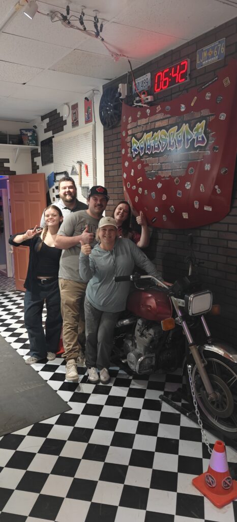 Birthday party group photo at paint splatter room Oceanside