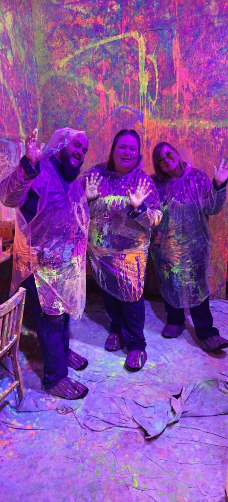 Paint rage session splashing neon colors blacklight room