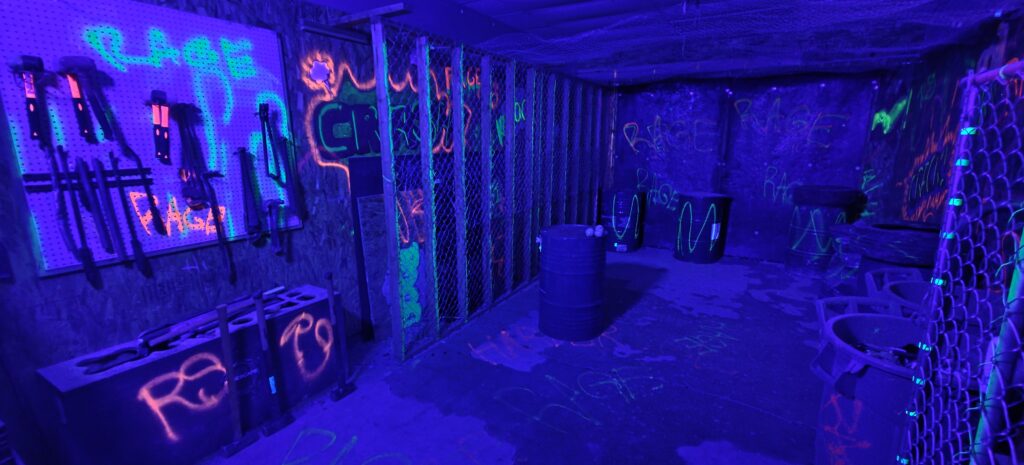 Paint splatter room neon UV blacklight experience San Diego